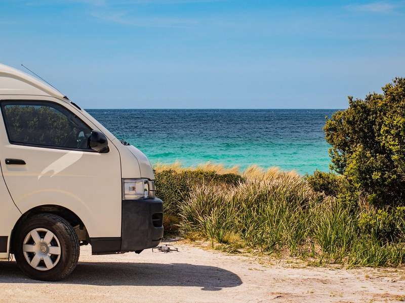 Tasvanlife campervan parked by the coast